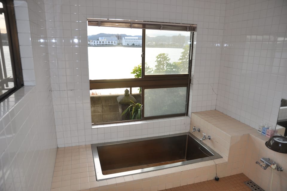 Shower, free toiletries, hair dryer, slippers