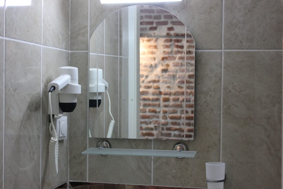 Shower, free toiletries, hair dryer, slippers