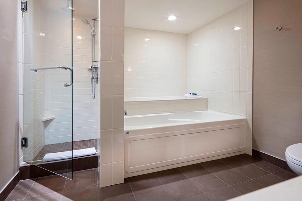 Separate tub and shower, designer toiletries, hair dryer, towels