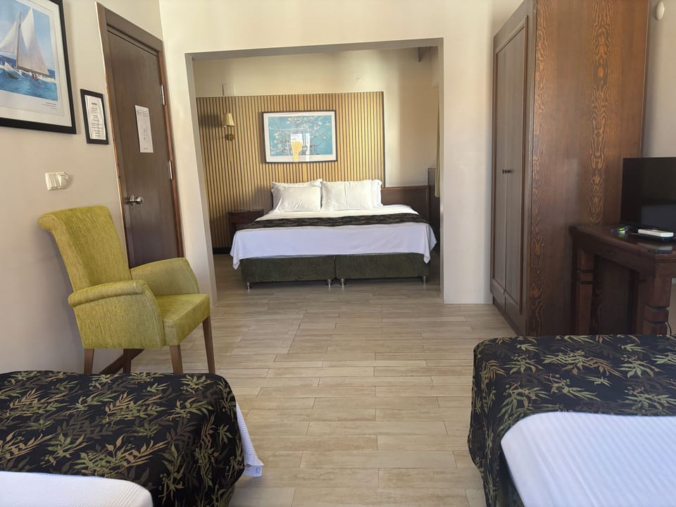 Deluxe Quadruple Room | Premium bedding, minibar, in-room safe, laptop workspace