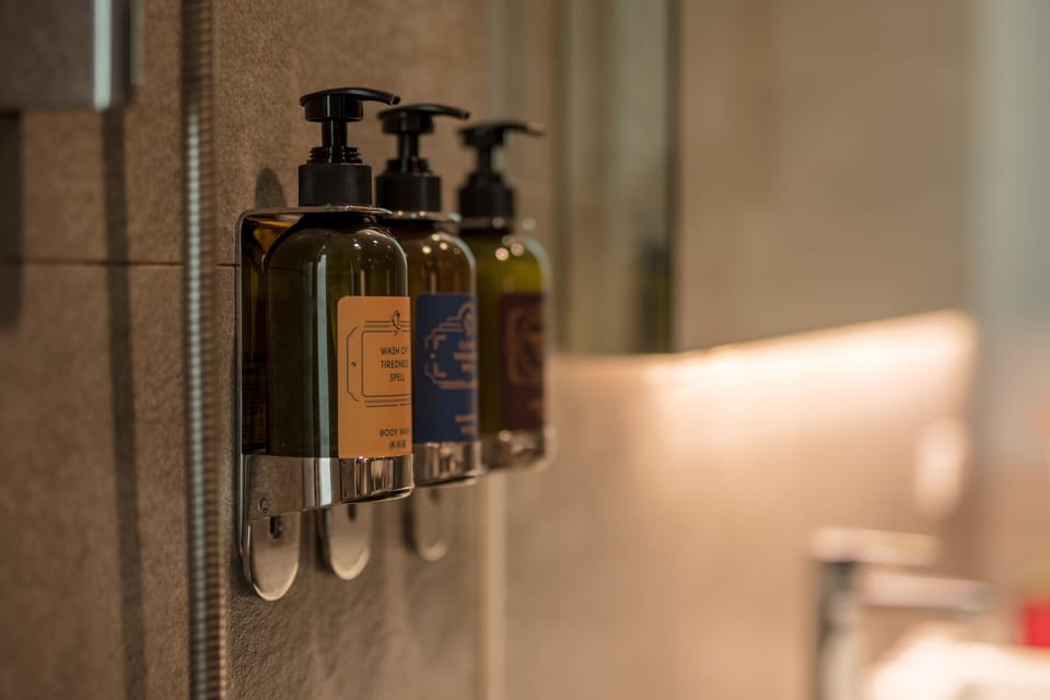 Deluxe Quadruple Room, 2 Double Beds, Bathtub | Bathroom | Hair dryer, slippers, towels, shampoo