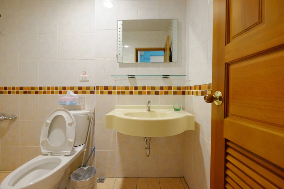 Standard Quadruple Room, 1 Bedroom | Bathroom | Shower, hair dryer, slippers, towels