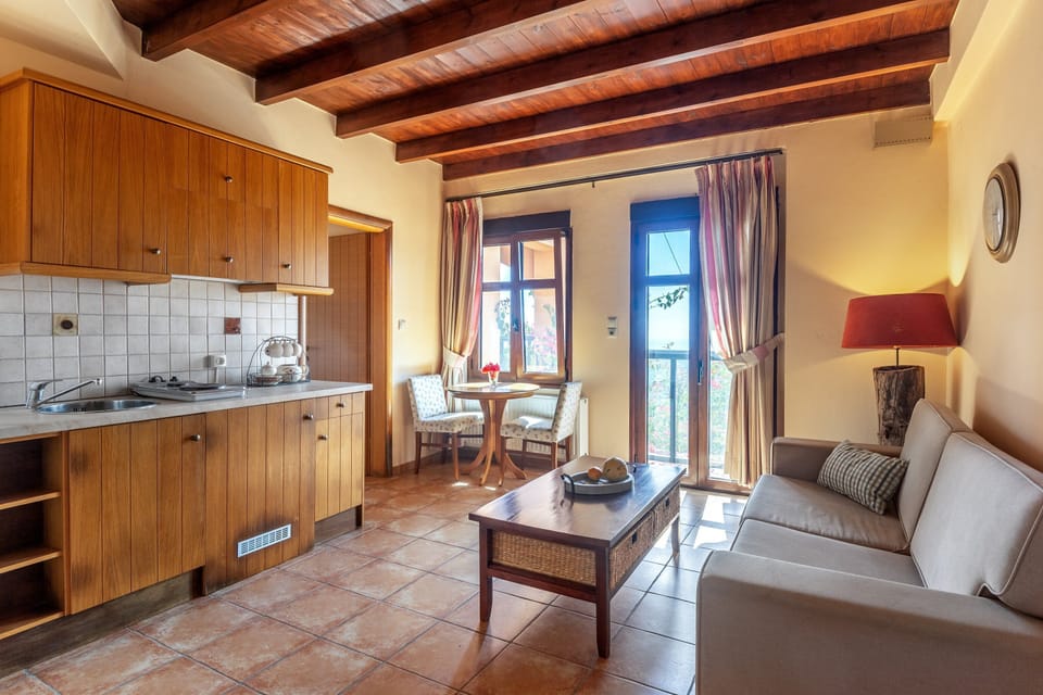 Deluxe Room, Jetted Tub | Private kitchen | Fridge, stovetop, electric kettle, cookware/dishes/utensils