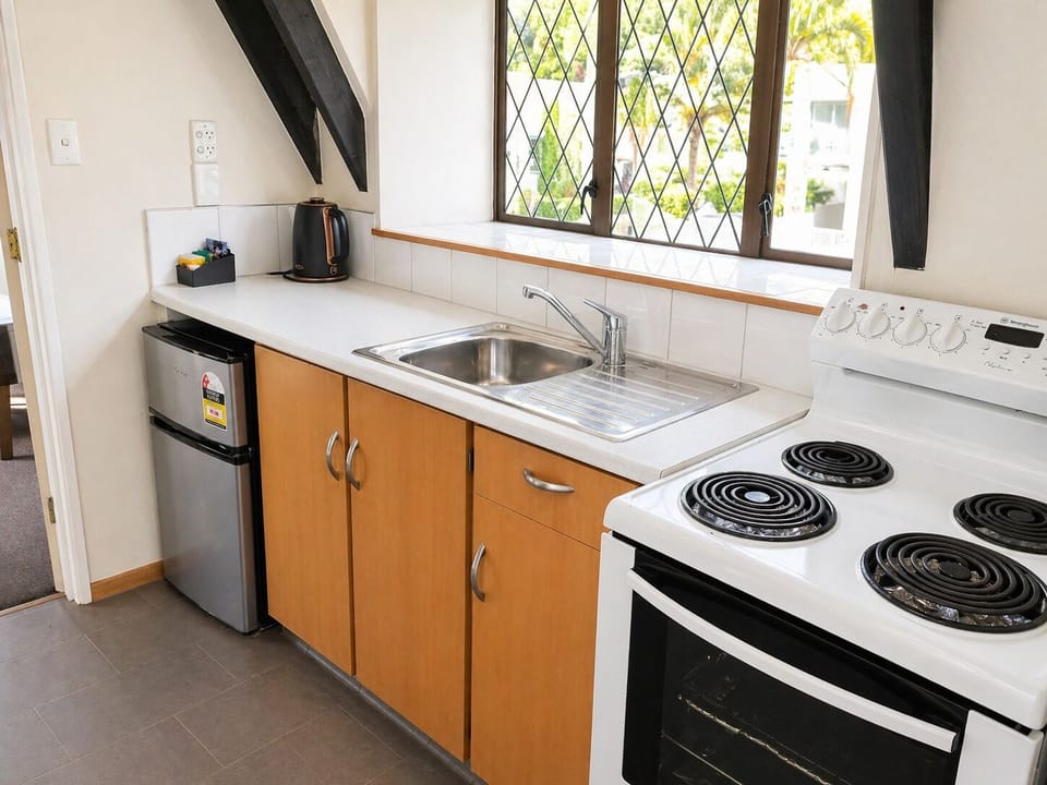 Fridge, microwave, electric kettle, cookware/dishes/utensils