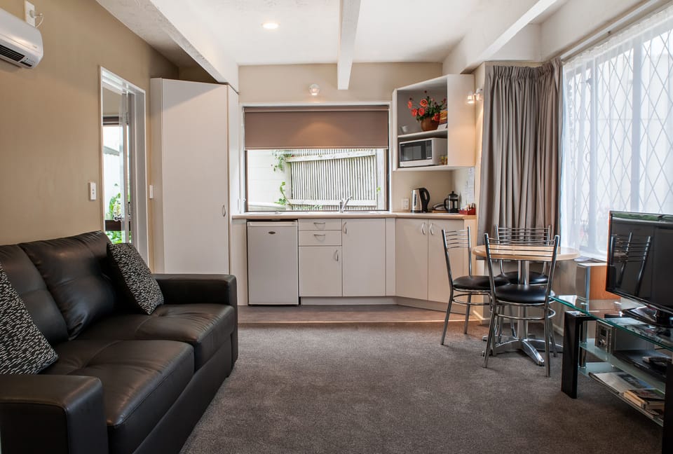One Bedroom Downstairs Spa Unit | Living area | LED TV, DVD player