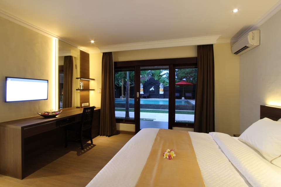 Deluxe Room | Premium bedding, in-room safe, desk, blackout drapes