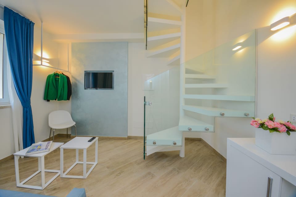 Panoramic Suite, 1 Queen Bed, Lake View, Tower | Living room | Flat-screen TV