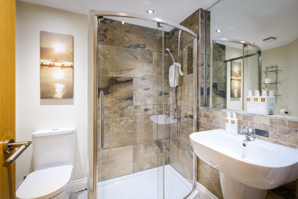 Hair dryer, bathrobes, towels, shampoo