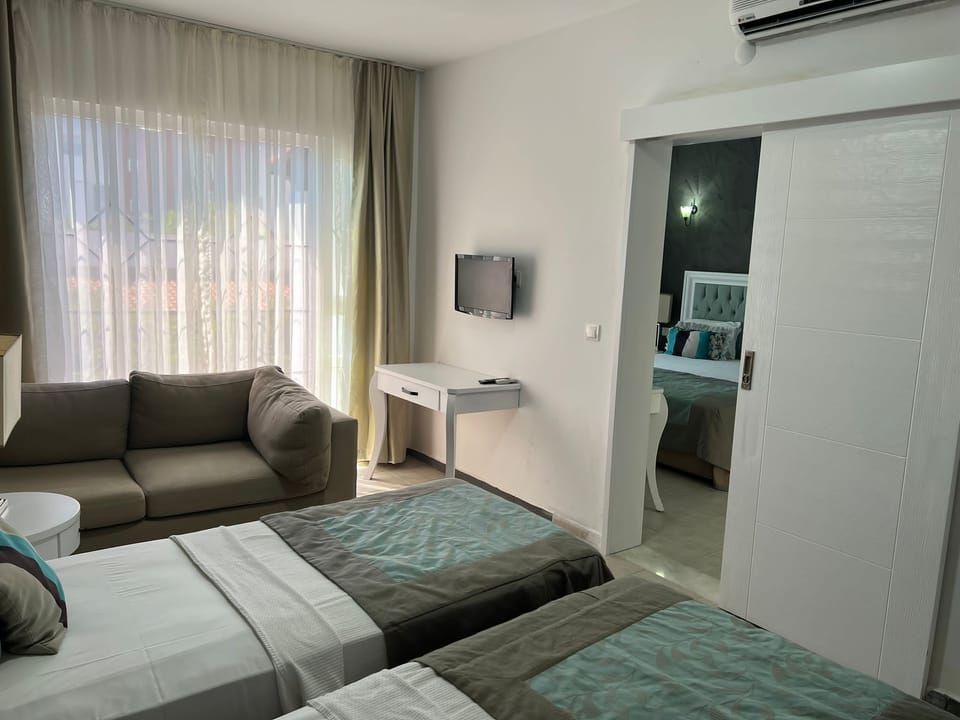 Family Room, 2 Bedrooms | Premium bedding, minibar, in-room safe, desk