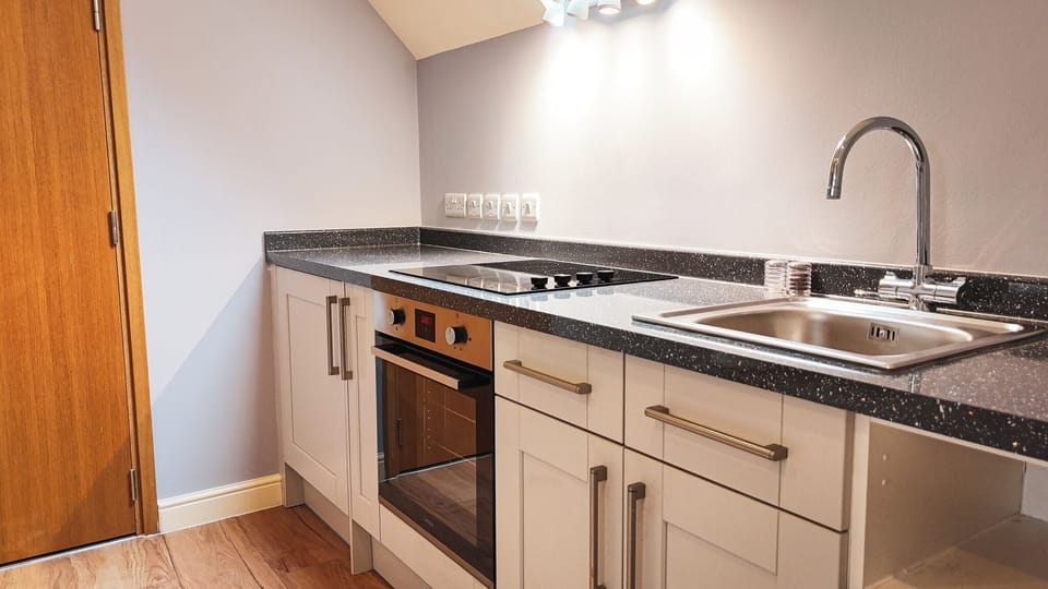 Deluxe Double Room | Private kitchen | Fridge, coffee/tea maker