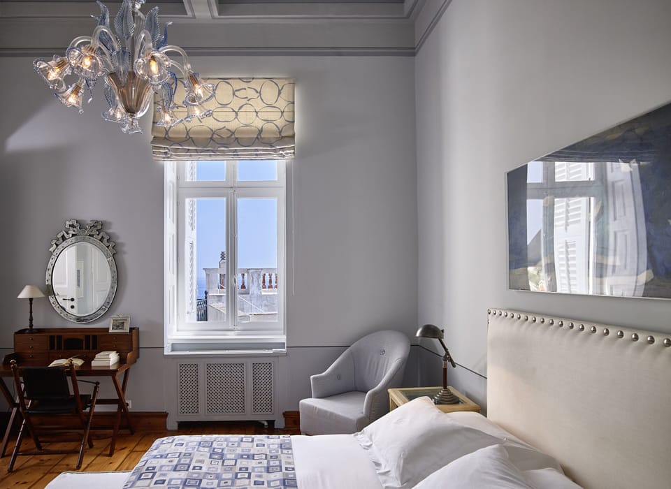 Deluxe Double Room, Sea View | Minibar, in-room safe, individually decorated, individually furnished