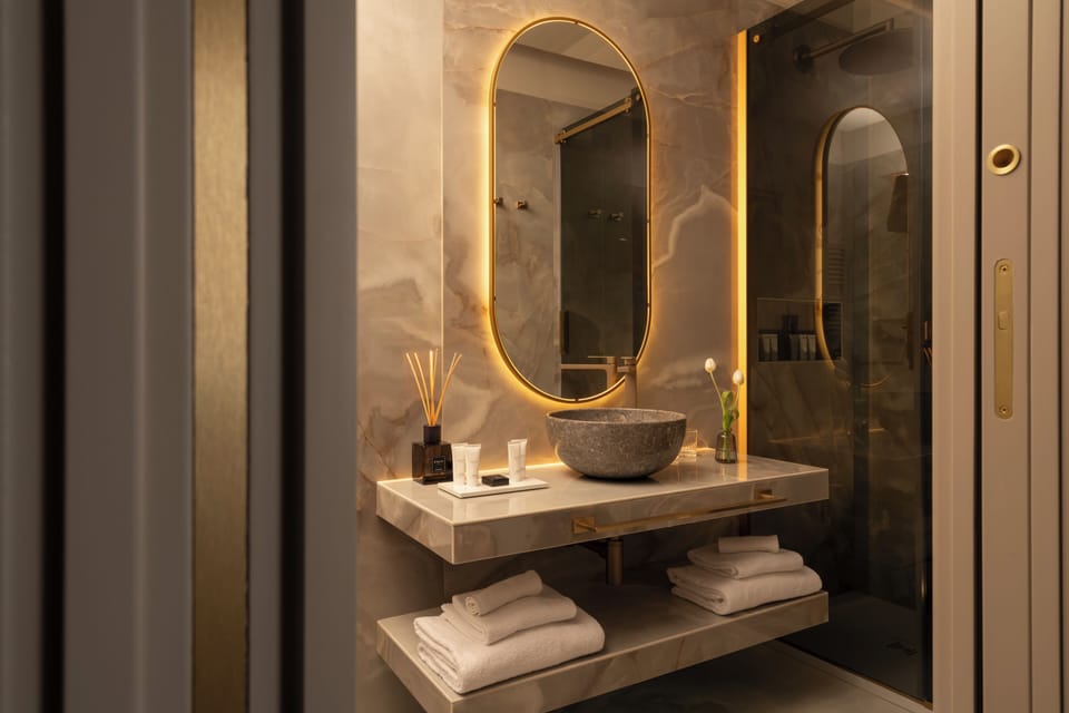 Shower, designer toiletries, hair dryer, bathrobes