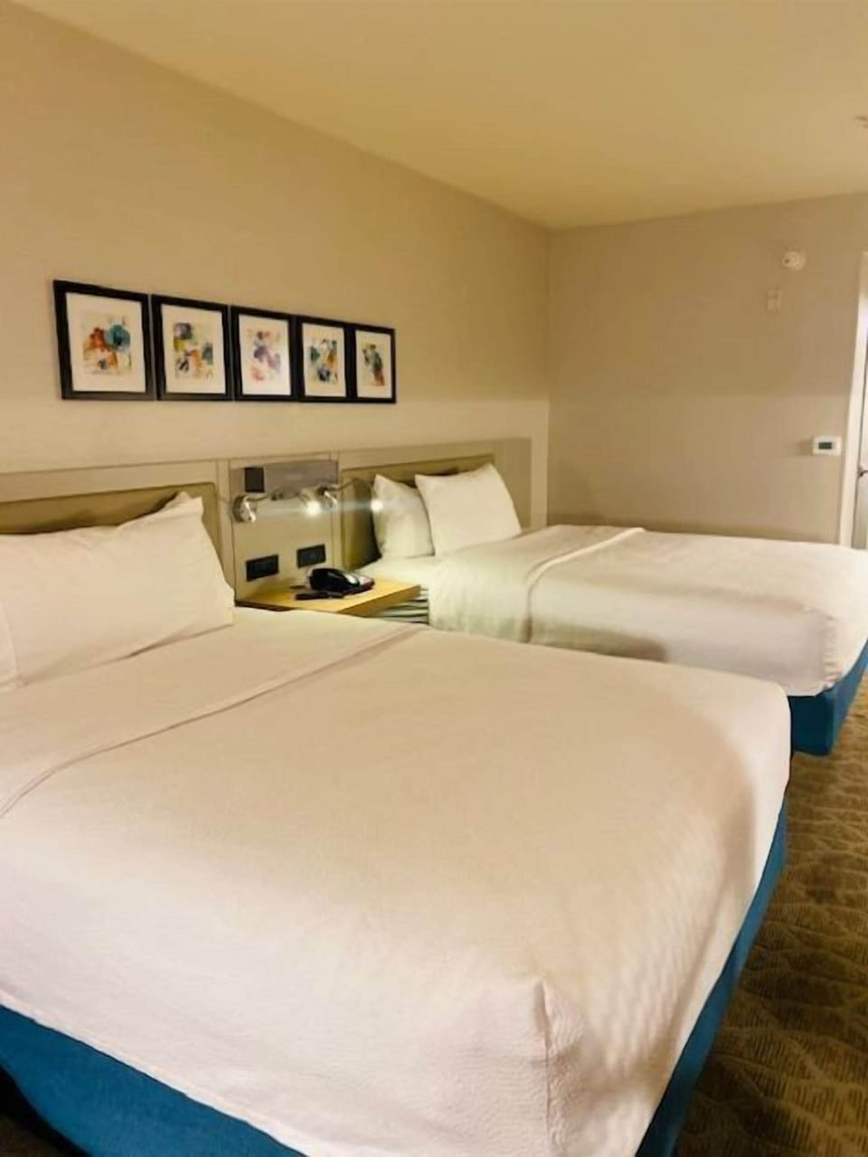 Two queen beds evolution | Hypo-allergenic bedding, desk, laptop workspace, iron/ironing board