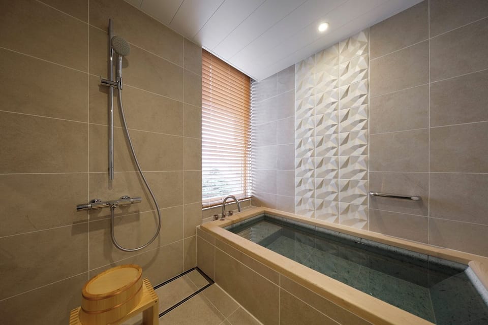 Separate tub and shower, free toiletries, hair dryer, bathrobes