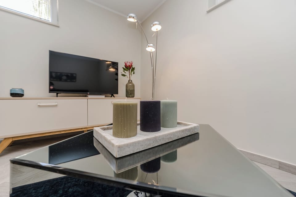 Standard Apartment, 1 Queen Bed with Sofa bed (Semi - Basement ) | 1 bedroom, in-room safe, desk, soundproofing
