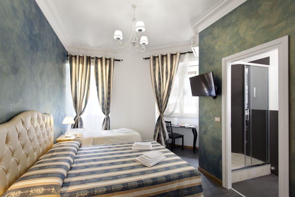 Deluxe Triple Room, Garden View | Premium bedding, minibar, desk, blackout drapes