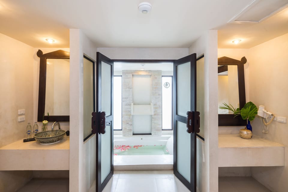 Suite, 2 Bedrooms - Free one way airport transfer | Bathroom | Separate tub and shower, deep soaking tub, free toiletries, hair dryer
