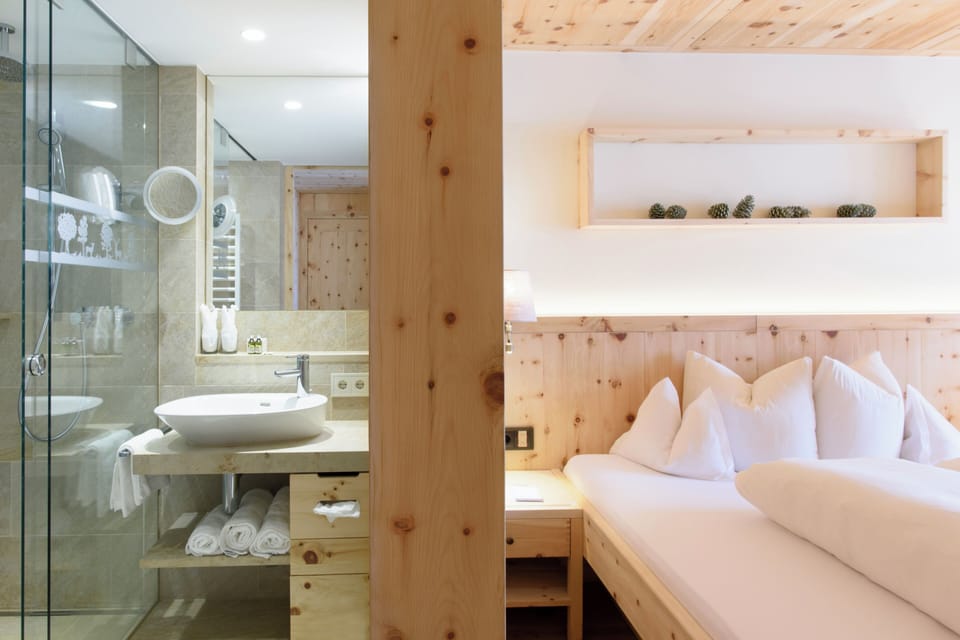 Comfort double room Swiss stone pine 29sqm | Bathroom | Free toiletries, hair dryer, bathrobes, slippers