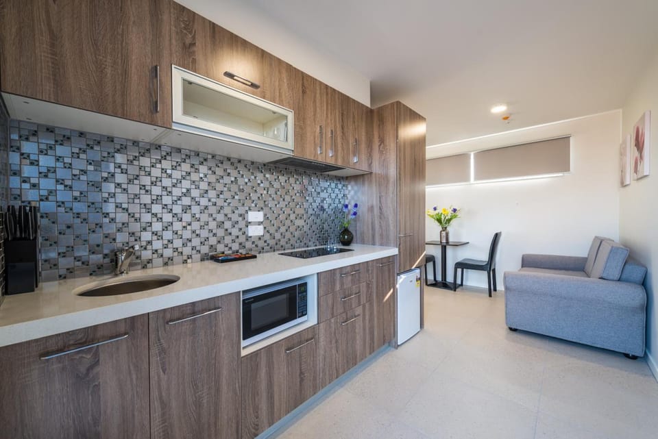Coffee/tea maker, refrigerator (on request), microwave, stovetop