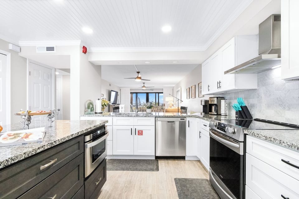 Direct Oceanfront Two-Bedroom Deluxe Condo - Unit 207 | Private kitchen | Fridge, microwave, oven, coffee/tea maker