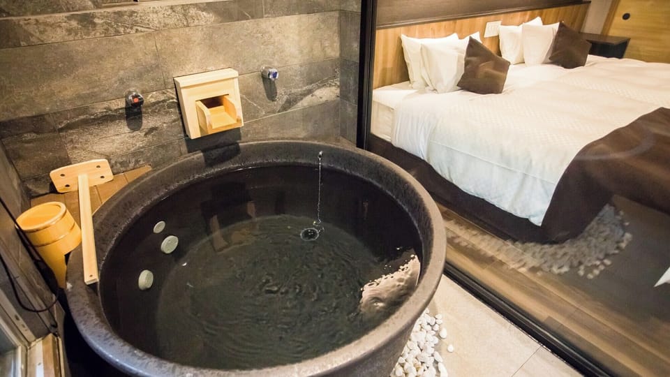 Modern Western Suite Japanese Western Room with Open-air Bath, Smoking | Bathroom | Separate tub and shower, spring water tub, free toiletries, hair dryer