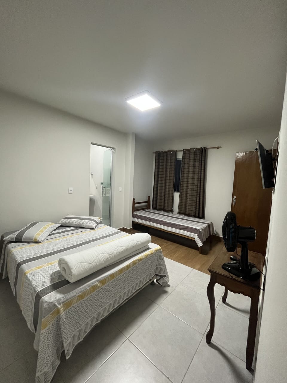 Family Room | Minibar, desk, blackout drapes, iron/ironing board