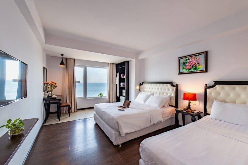 Triple Room With Sea View | Minibar, in-room safe, desk, free WiFi