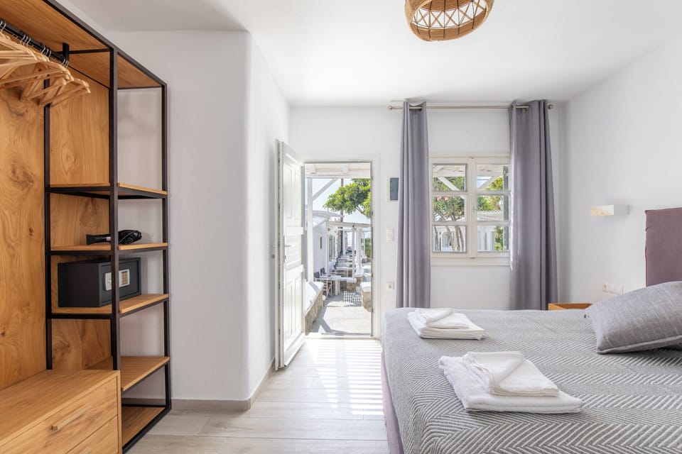 Deluxe Triple Room, Terrace, Sea View | In-room safe, soundproofing, iron/ironing board, free cribs/infant beds