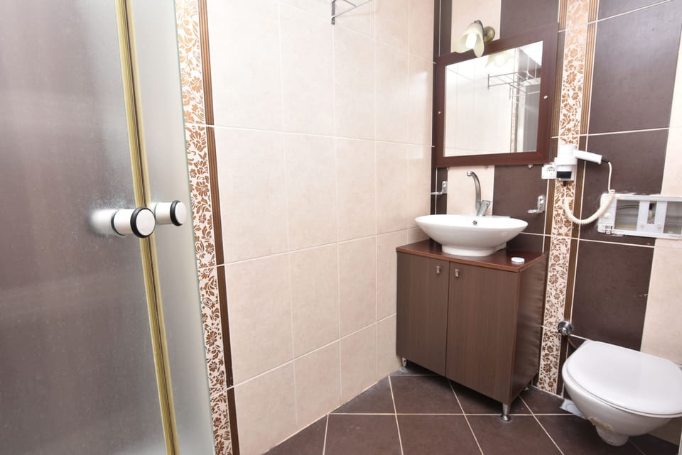 Shower, free toiletries, hair dryer, slippers