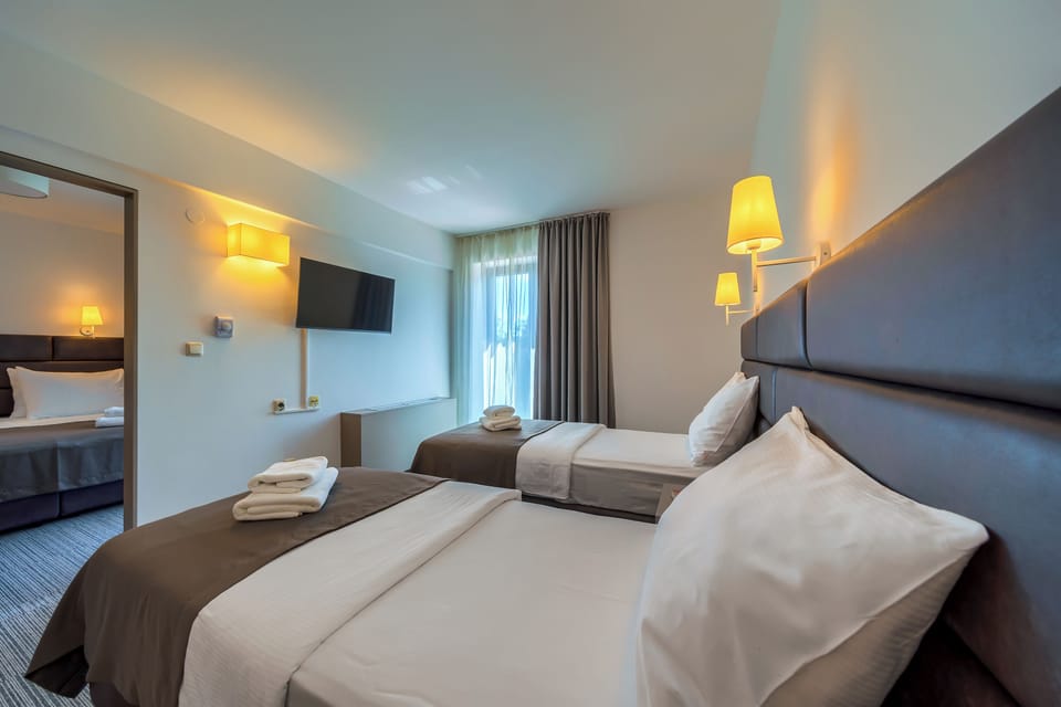 Family Room, 2 Bedrooms, Balcony, Park View | Desk, laptop workspace, free WiFi, bed sheets