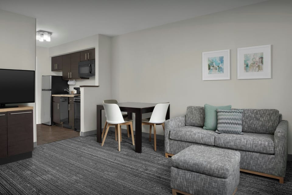 Suite, 1 Bedroom | Living area | 32-inch TV with cable channels, Netflix, iPod dock