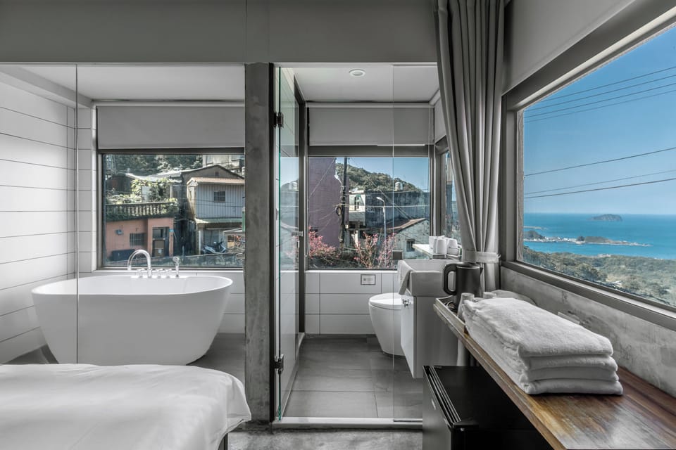 Sea view deluxe quadra room with bathtub | Bathroom | Hair dryer, slippers, towels