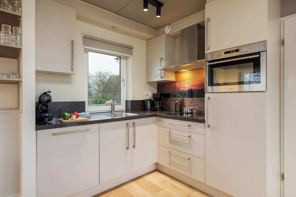 Deluxe Cottage, 2 Bedrooms | Private kitchen | Fridge, microwave, stovetop, dishwasher