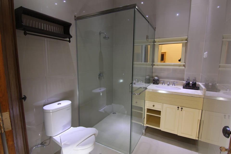 Shower, free toiletries, slippers, towels
