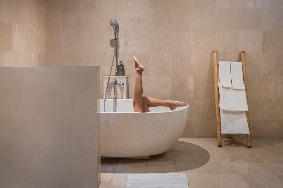 Separate tub and shower, free toiletries, hair dryer, slippers