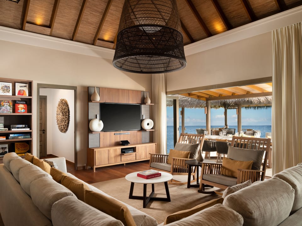 The Vakkaru Over Water Residence | Living room | 42-inch flat-screen TV with cable channels, TV, foosball