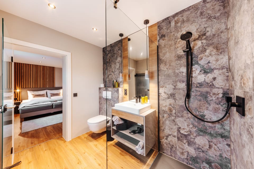 Deluxe Studio, 1 Bedroom, Garden Area | Down comforters, in-room safe, individually decorated, desk