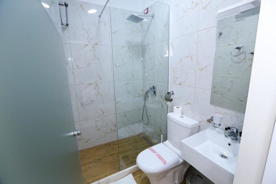 Shower, free toiletries, hair dryer, slippers