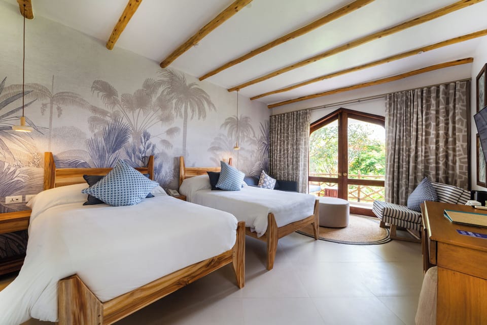 Deluxe Ocean View Room | Minibar, in-room safe, desk, iron/ironing board