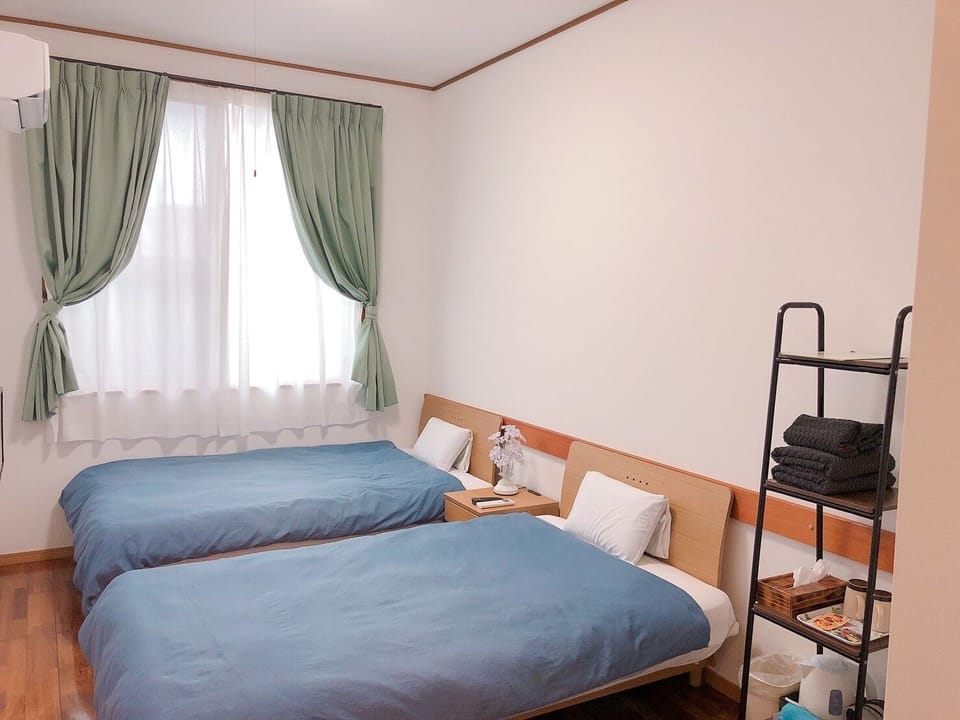 Twin Room | Iron/ironing board, bed sheets