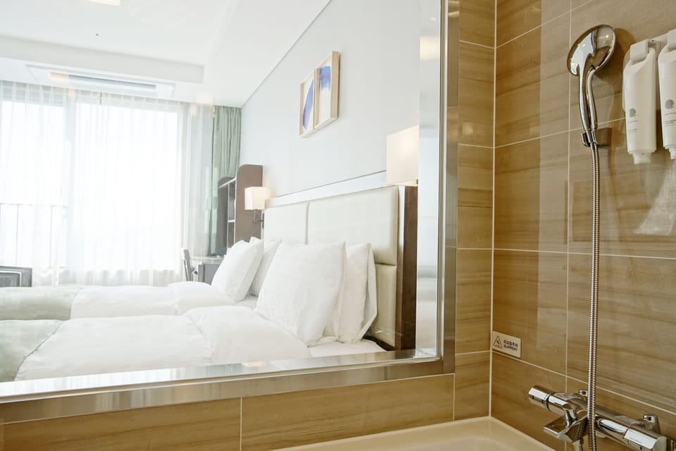 Combined shower/tub, hair dryer, bathrobes, slippers