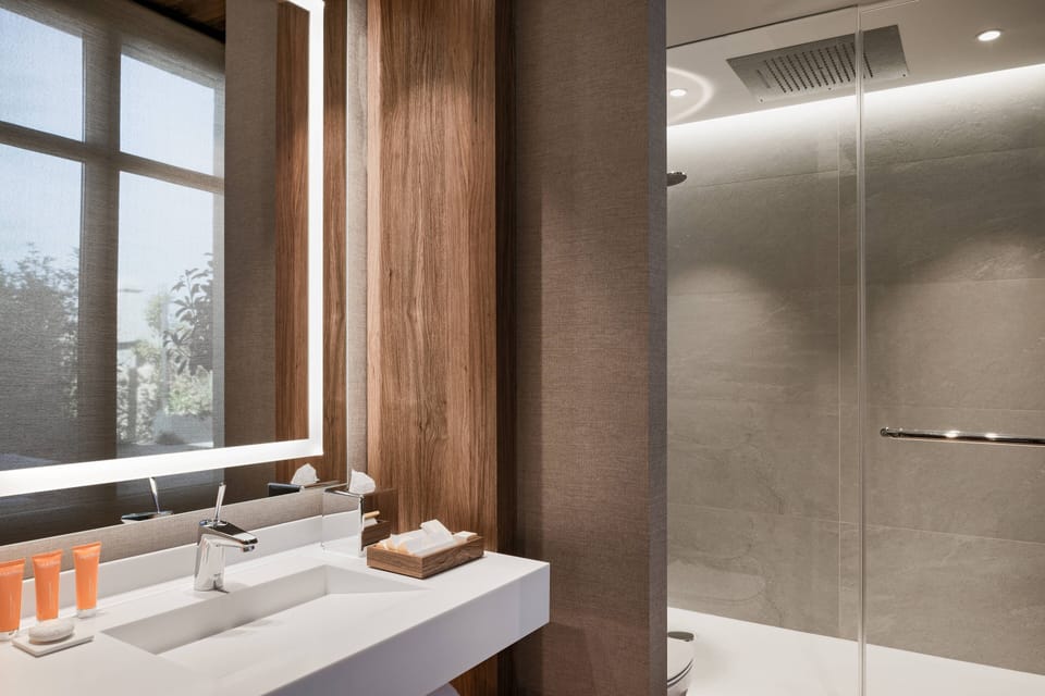 Suite, 1 King Bed, Terrace | Bathroom | Shower, hair dryer, bathrobes, slippers