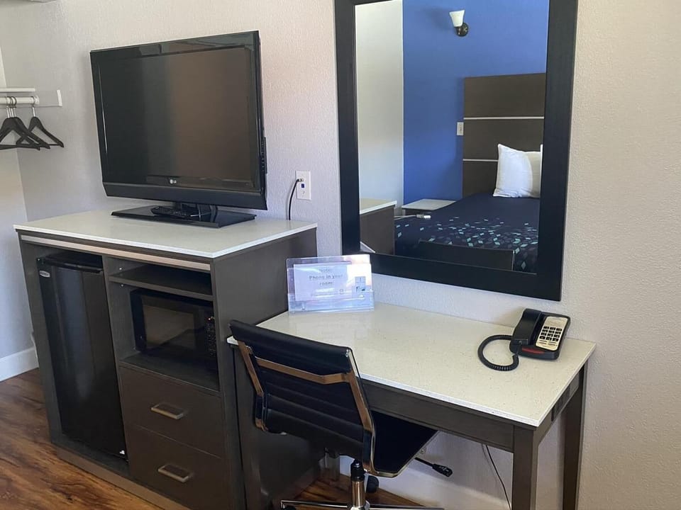 Desk, laptop workspace, blackout drapes, soundproofing
