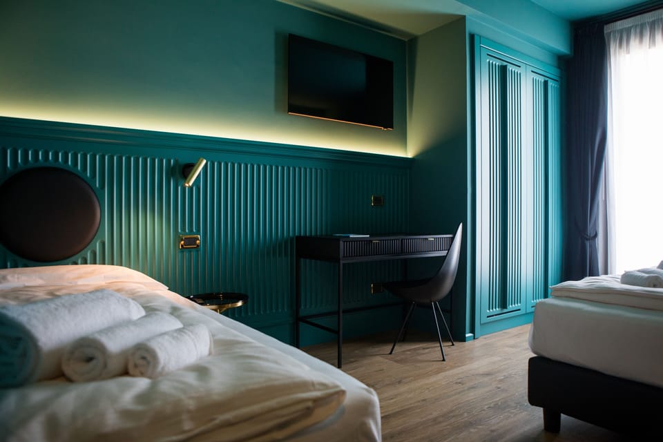 Triple Room, Balcony | In-room safe, desk, free WiFi, bed sheets