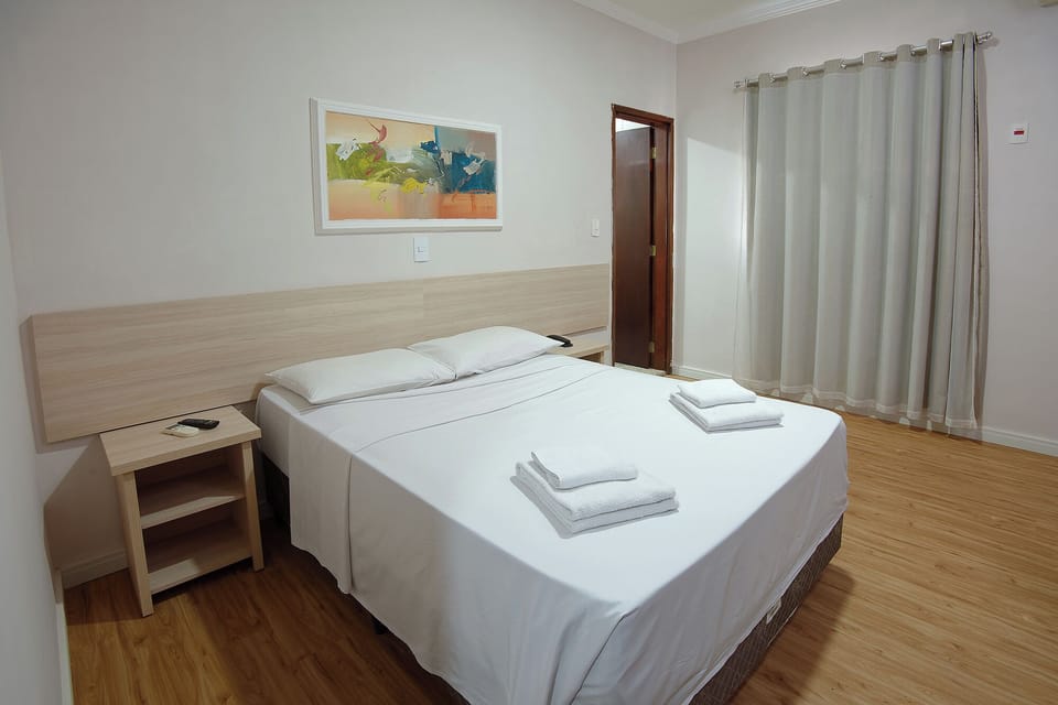 Economy Double Room | Minibar, desk, blackout drapes, free WiFi