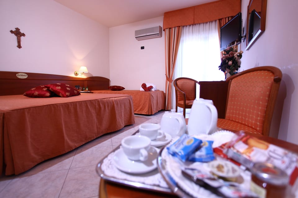 Deluxe Triple Room, Sea View | Minibar, in-room safe, desk, soundproofing