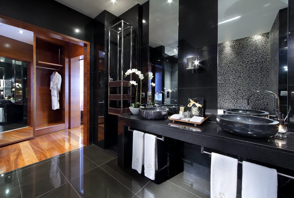 Separate tub and shower, designer toiletries, hair dryer, towels