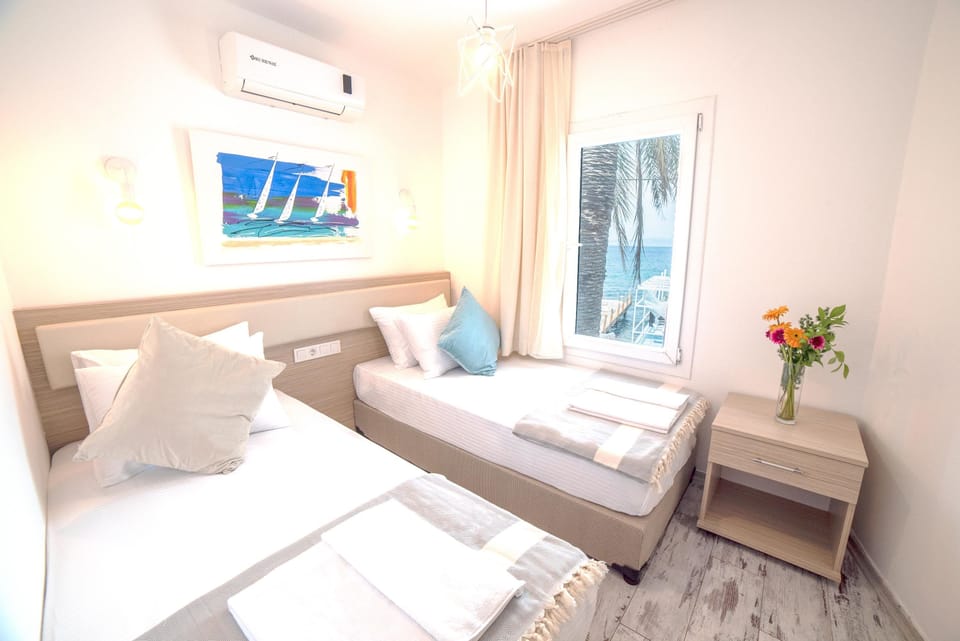 Deluxe Suite, Sea View | Free minibar items, desk, iron/ironing board, free WiFi