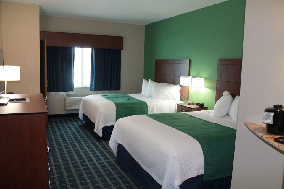 Deluxe Room, 2 Queen Beds | Premium bedding, desk, iron/ironing board, cribs/infant beds