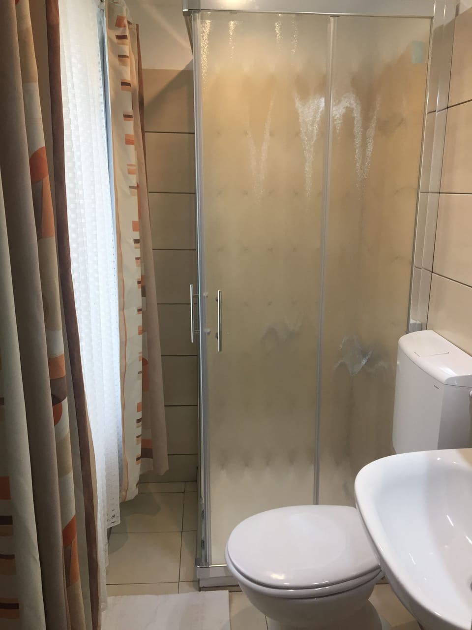 Shower, eco-friendly toiletries, hair dryer, towels